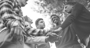 Group of professionals shaking hands and getting ready to work together