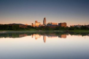 nebraska skyline reflected on downtown lake