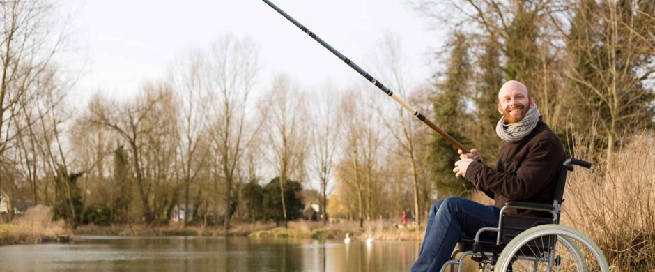 man on wheelchair spending quality time in fishing day