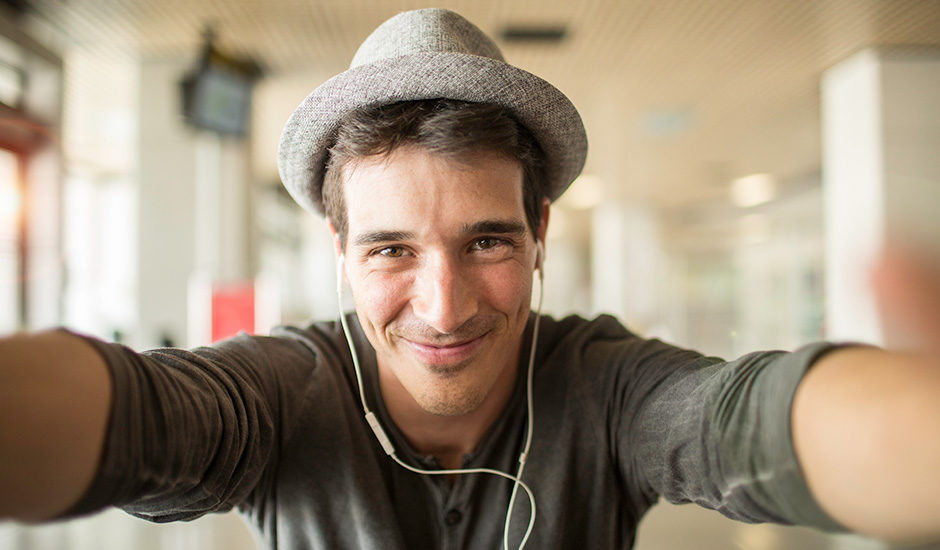 Blog featured image: A smiling man taking a selfie